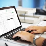 hands typing on a laptop keyboard can show how a great subject line can help a PR pitch stand out