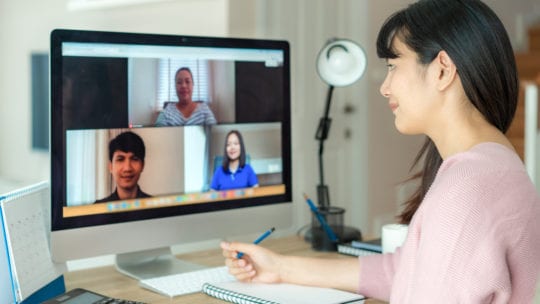 Asian woman video conferencing