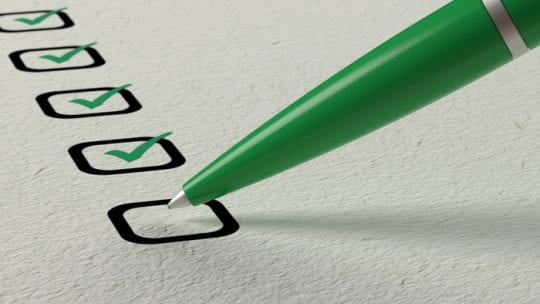 green pen creating a checklist