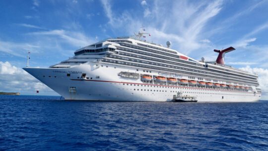 Carnival Cruise Line ship on the open sea, blue sky