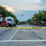 Police caution tape crosses street in Highland Park after Fourth of July shooting incident