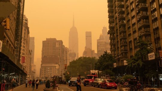 The Empire State Building disappears in an orange haze due to the Canadian Wildfire smoke clouds drifting over the Northeastern U.S.