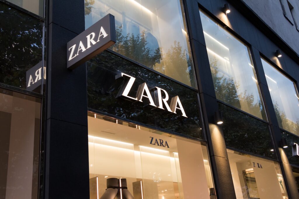 A sales clerk places clothes in the new Zara megastore at